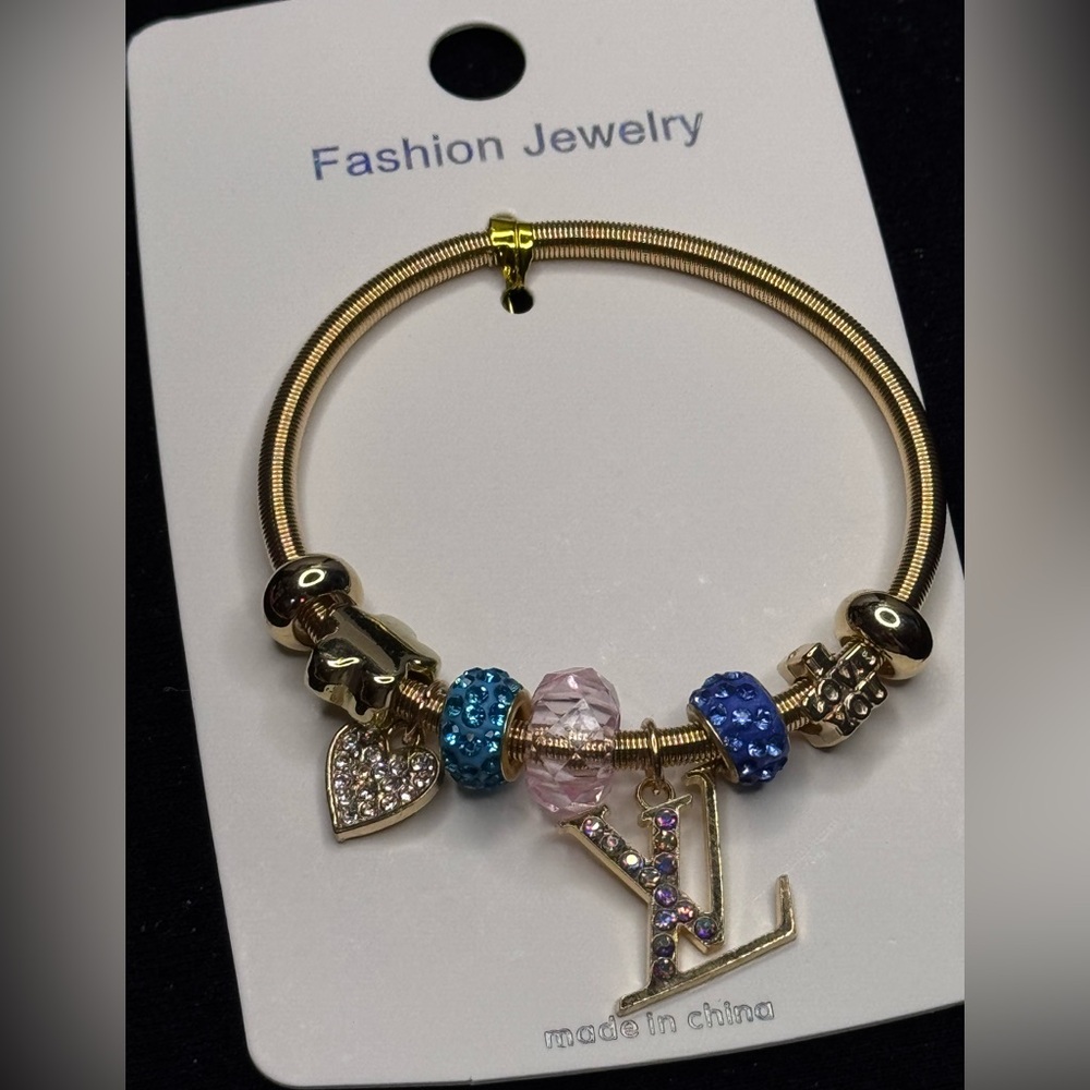 Fashion Jewelry Gold Tone Sparkling Heart
Charm Stretch Bracelet Blue Blue
